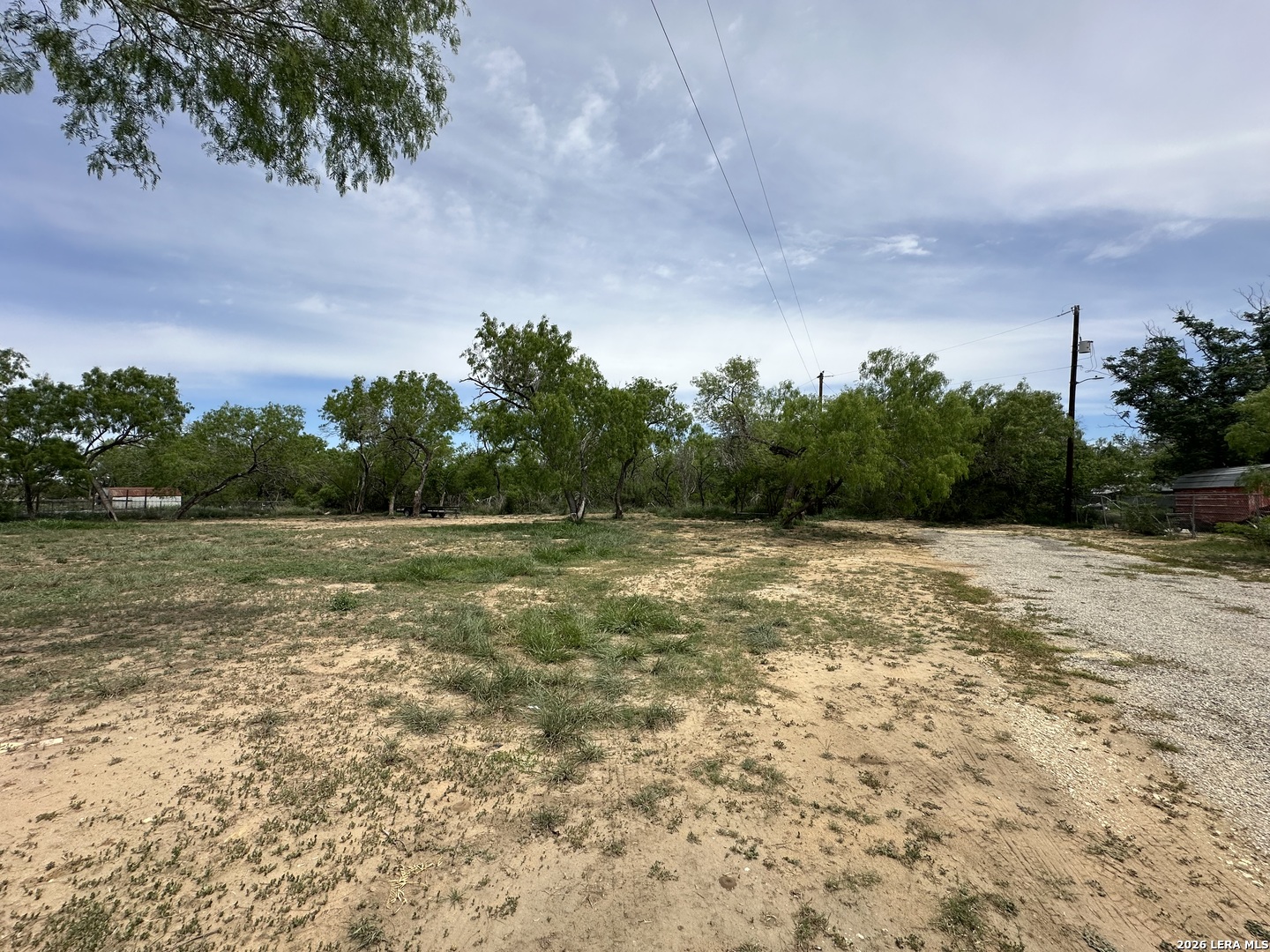 Tbd East 2nd Elmendorf, TX 78112 - Photo 1 of 16 a view of a green field with wooden fence