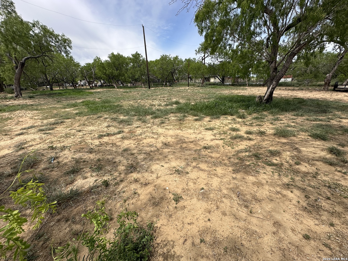Tbd East 2nd Elmendorf, TX 78112 - Photo 2 of 16 a view of a field with trees in the background