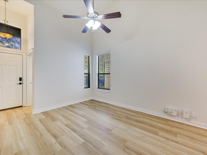 2101 Rivers Edge Way, Unit 29 Austin, TX 78741 - Photo 3 of 38 Entry & Living with beautiful new flooring.