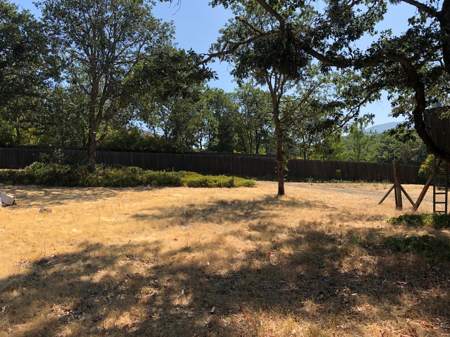 881 Three Pines Road Grants Pass, OR 97526 - Photo 2 of 15 a view of yard with a slide