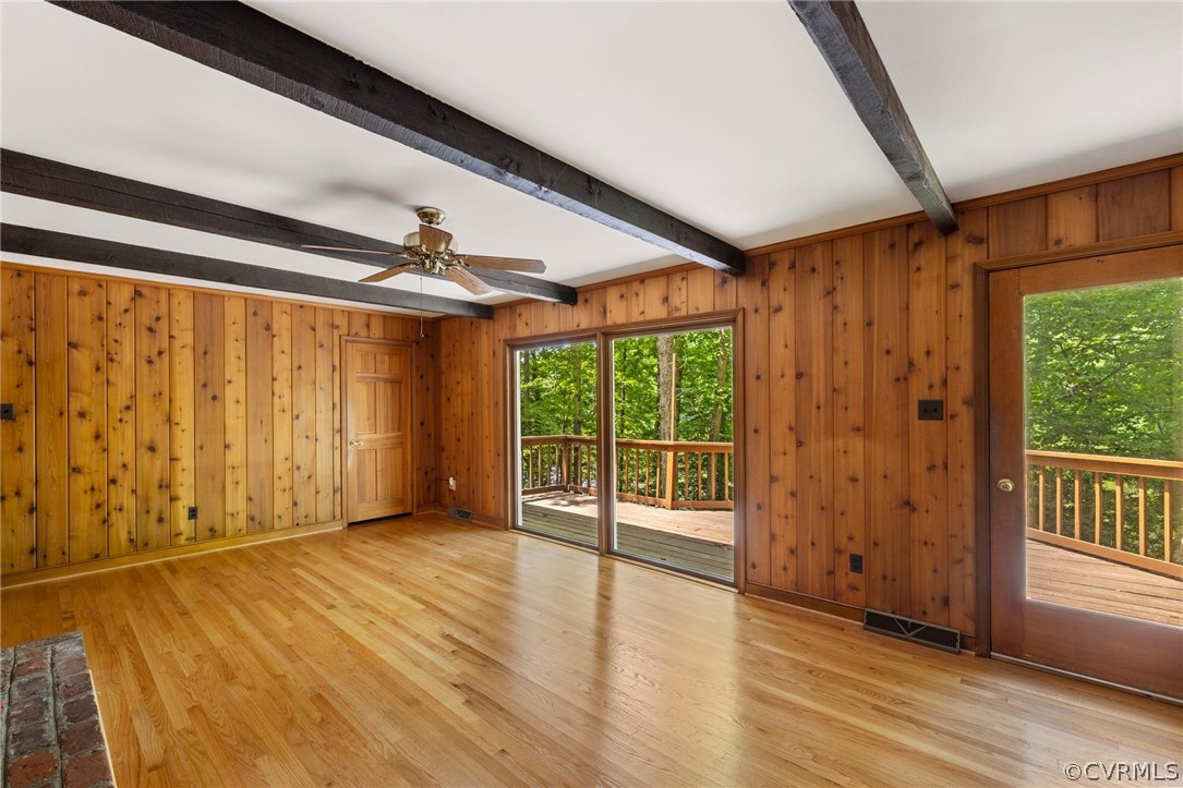 4534 Forrestal Road Chester, VA 23831 - Photo 11 of 39 an empty room with wooden floor and windows