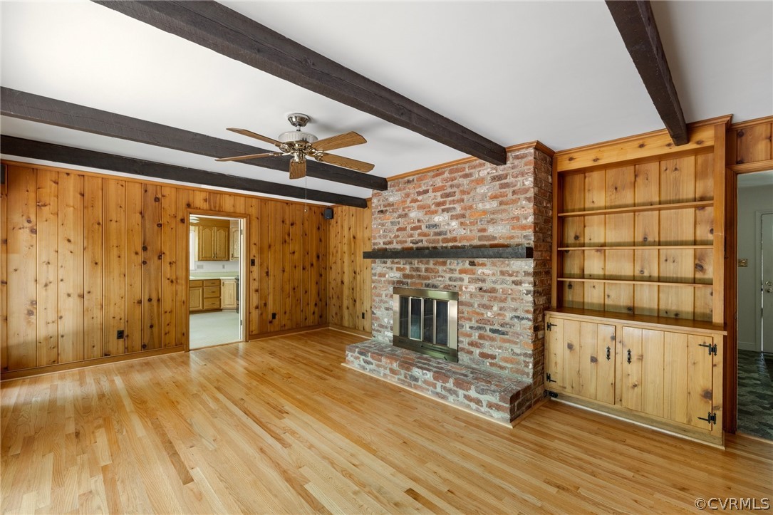 4534 Forrestal Road Chester, VA 23831 - Photo 16 of 39 a view of a livingroom with wooden floor and a fireplace