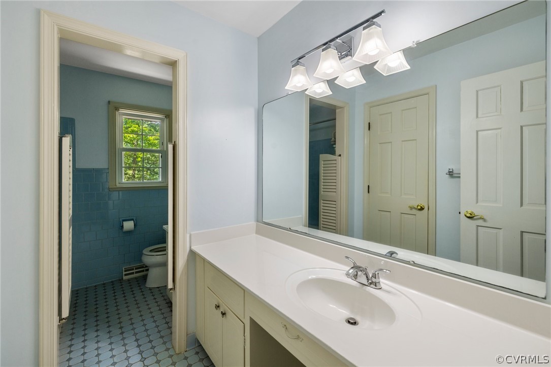 4534 Forrestal Road Chester, VA 23831 - Photo 19 of 39 a spacious bathroom with a double vanity sink and a mirror
