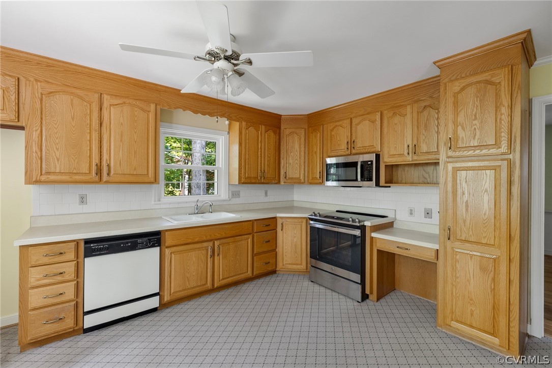 4534 Forrestal Road Chester, VA 23831 - Photo 9 of 39 a kitchen with stainless steel appliances granite countertop a stove sink and refrigerator