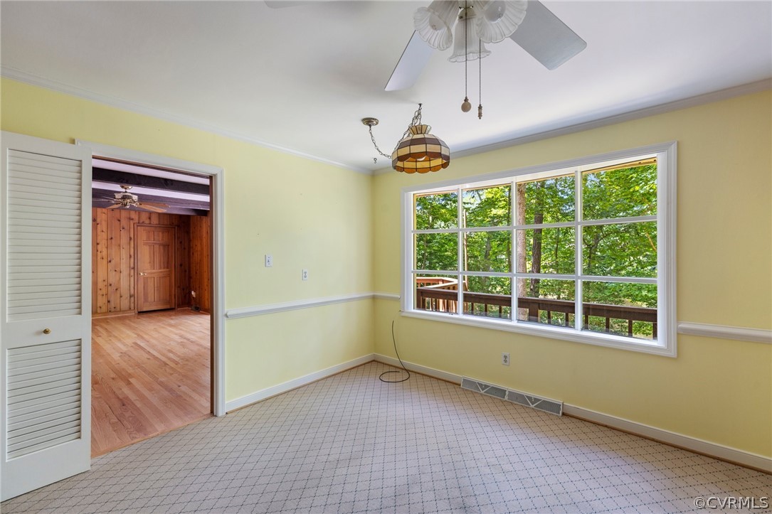 4534 Forrestal Road Chester, VA 23831 - Photo 10 of 39 an empty room with a window and chandelier