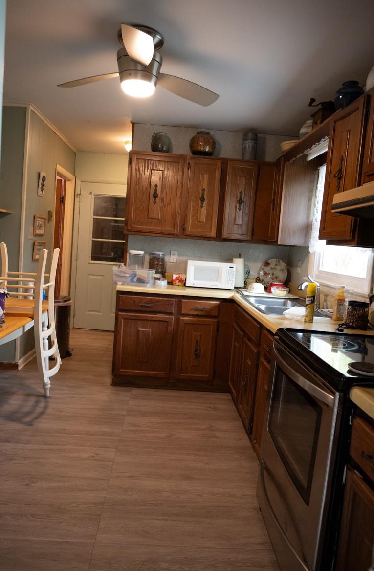 31858 River Park Road Millington, MD 21651 - Photo 12 of 14 a kitchen with stainless steel appliances granite countertop a sink a stove and a refrigerator