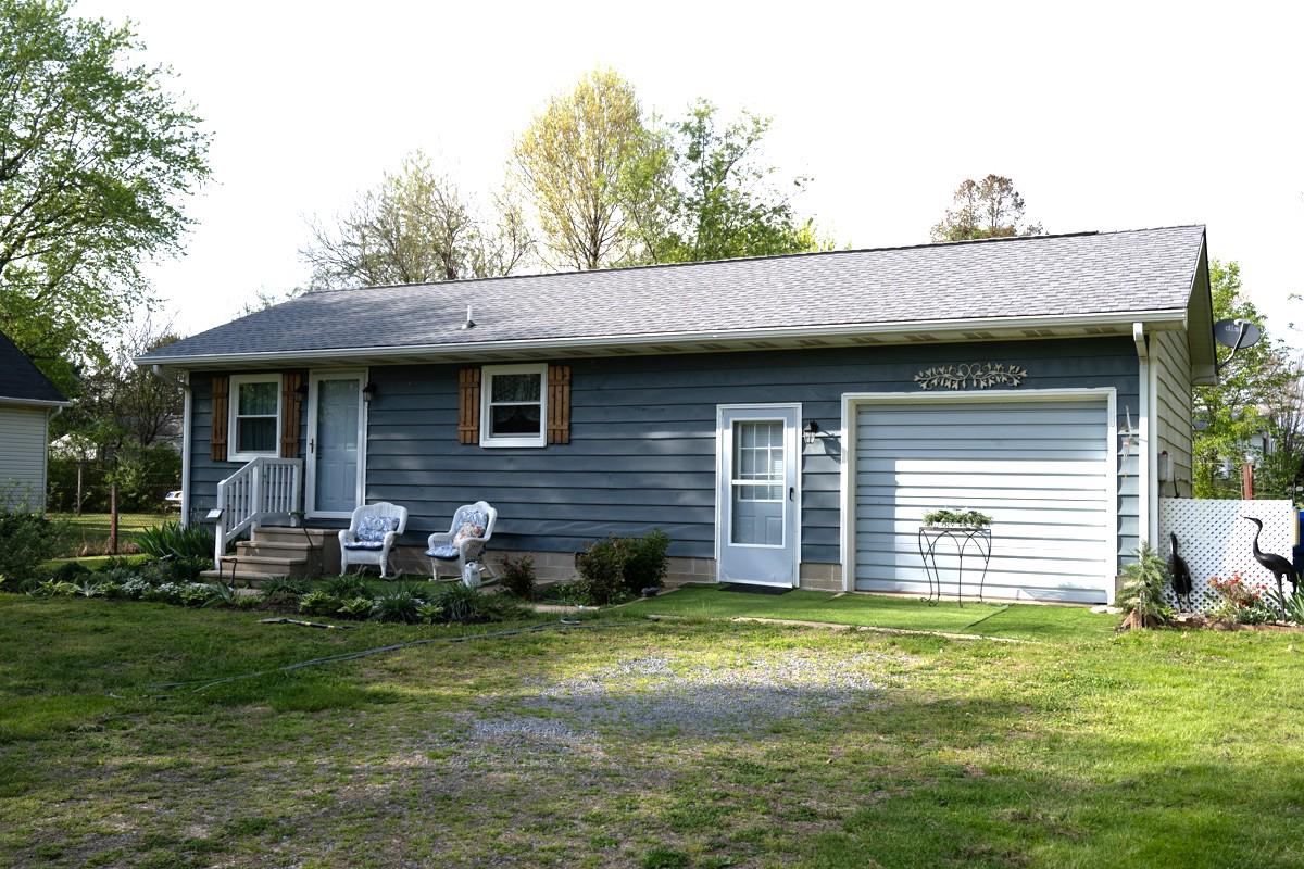 31858 River Park Road Millington, MD 21651 - Photo 2 of 14 a front view of a house with a garden