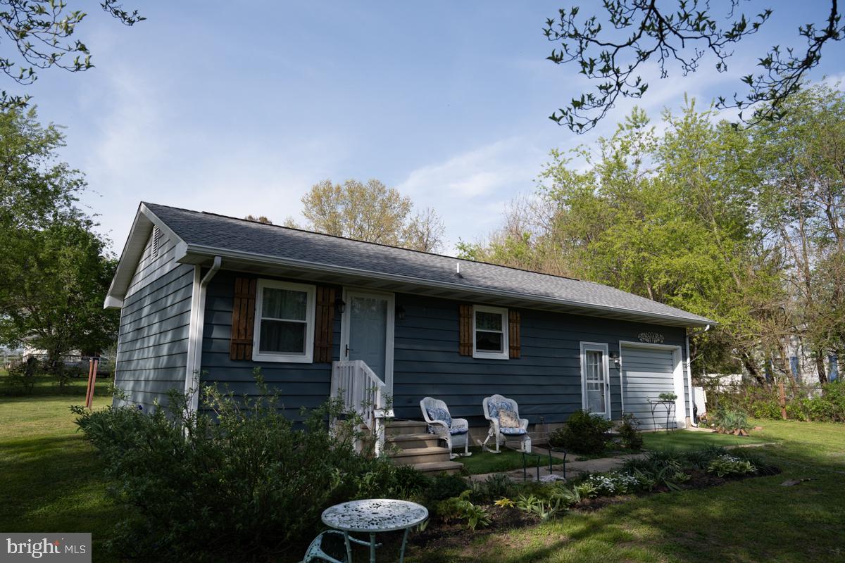 31858 River Park Road Millington, MD 21651 - Photo 9 of 15 a front view of a house with garden
