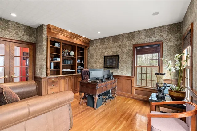 a living room with furniture rug and window