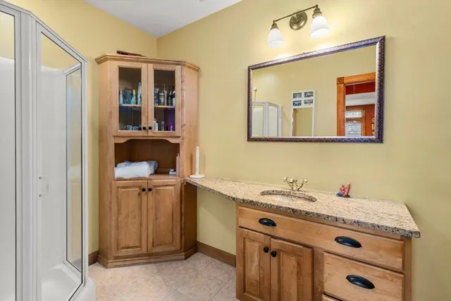 a bathroom with a sink and a mirror