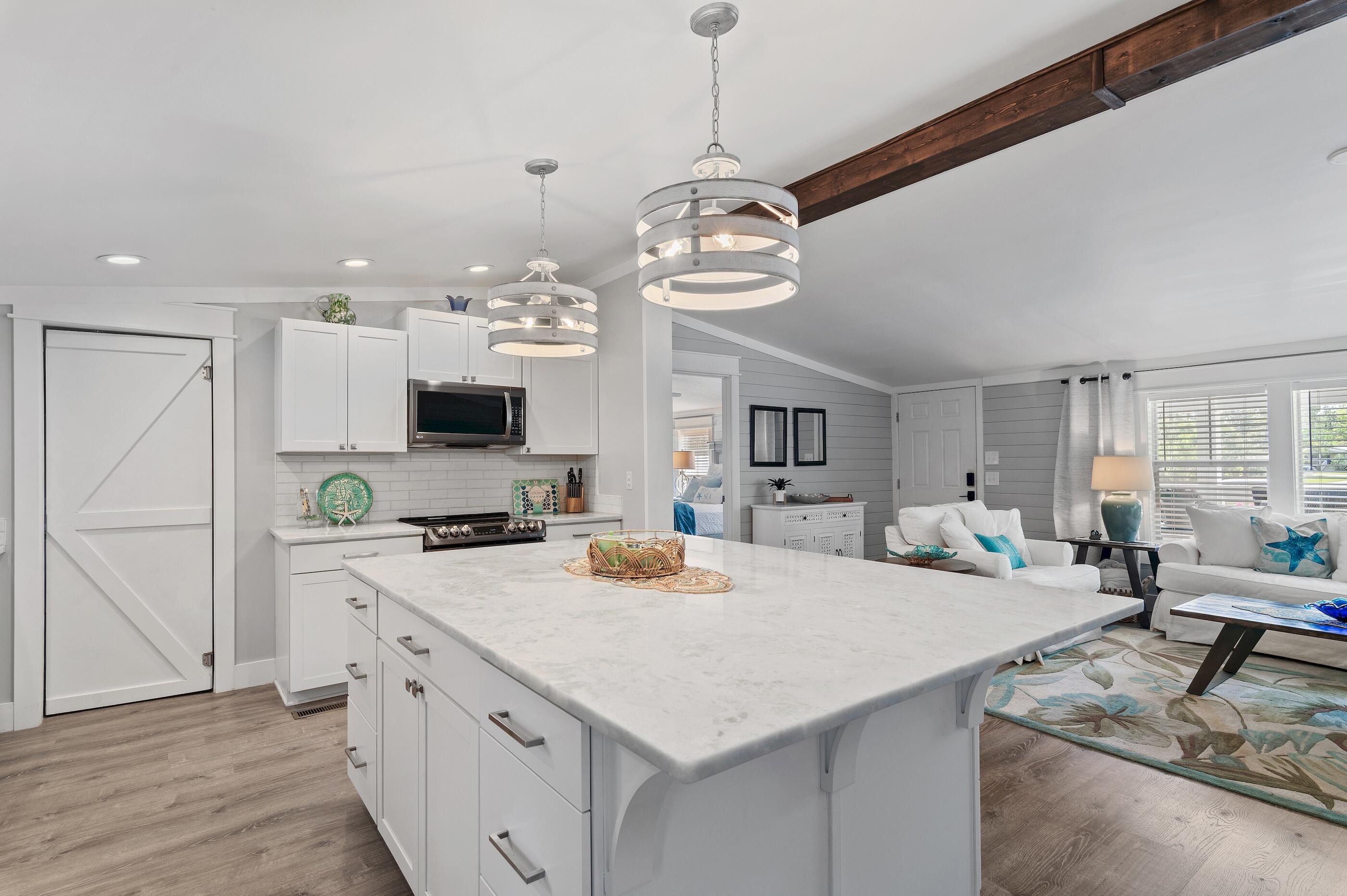 301 Edgewood Terrace Santa Rosa Beach, FL 32459 - Photo 11 of 34 a large kitchen with kitchen island a large island in it