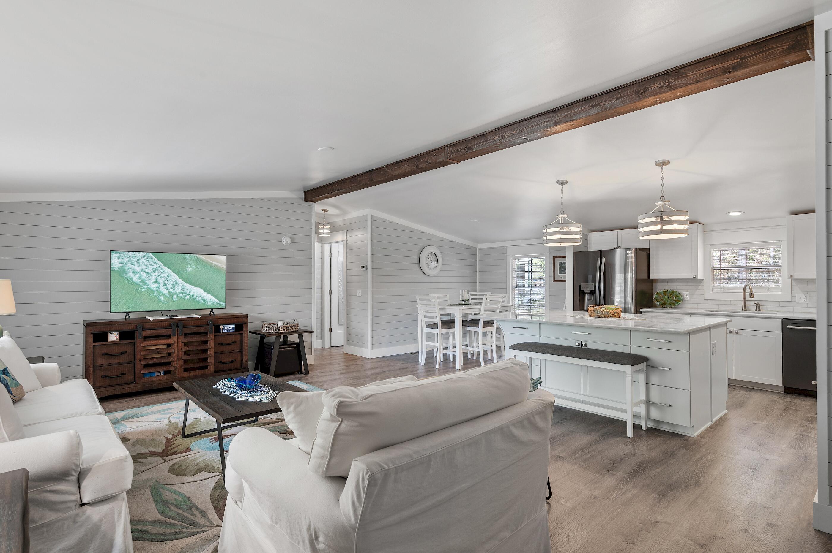 301 Edgewood Terrace Santa Rosa Beach, FL 32459 - Photo 14 of 34 a living room with furniture and a flat screen tv