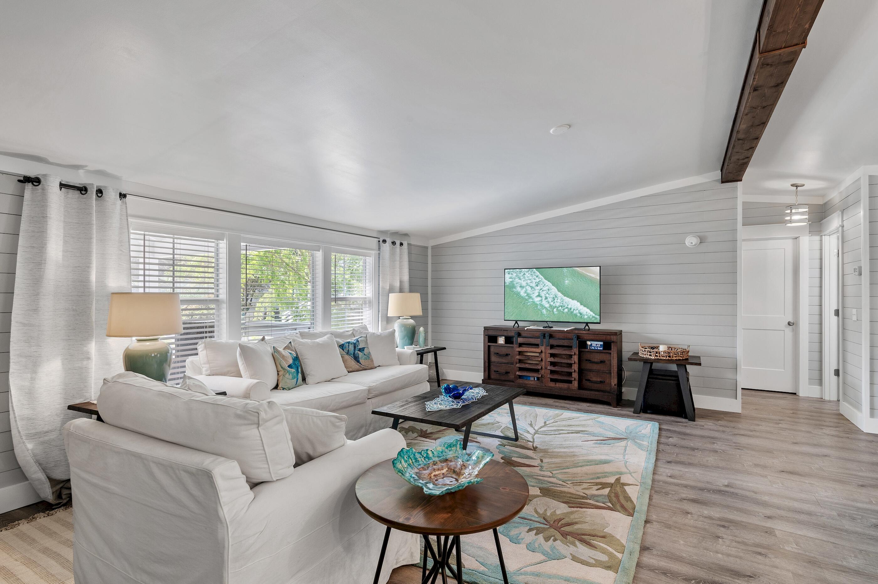 301 Edgewood Terrace Santa Rosa Beach, FL 32459 - Photo 16 of 34 a living room with furniture or couch and a wooden floor