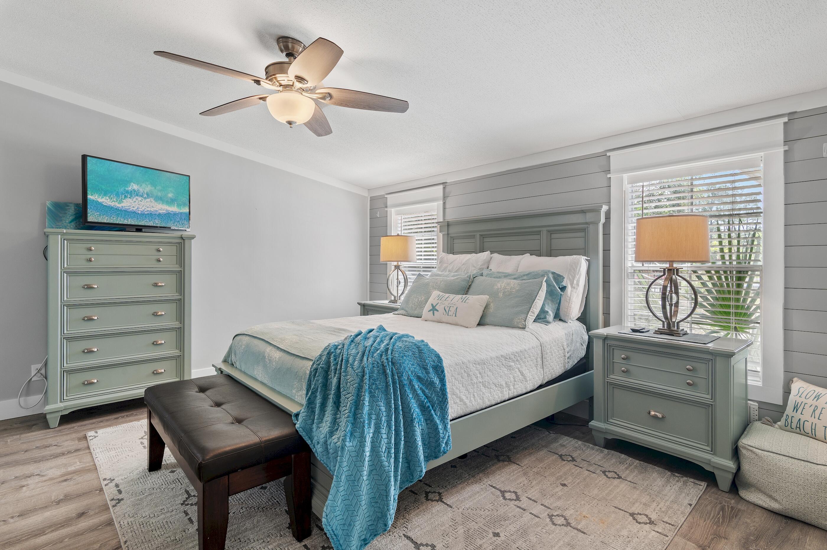 301 Edgewood Terrace Santa Rosa Beach, FL 32459 - Photo 17 of 34 a bedroom with a bed a furniture and a ceiling fan
