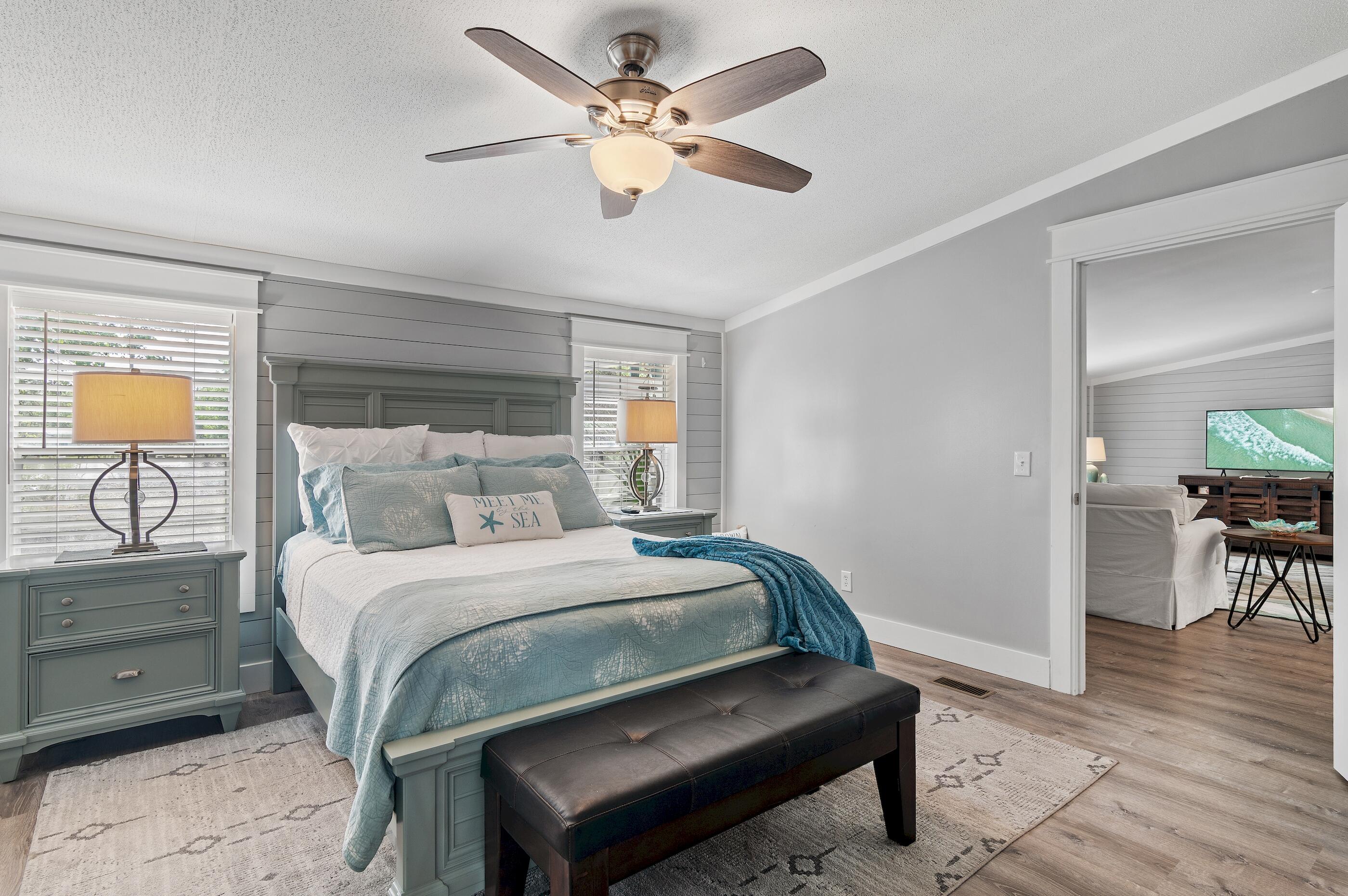 301 Edgewood Terrace Santa Rosa Beach, FL 32459 - Photo 18 of 34 a bedroom with a bed chandelier and a window