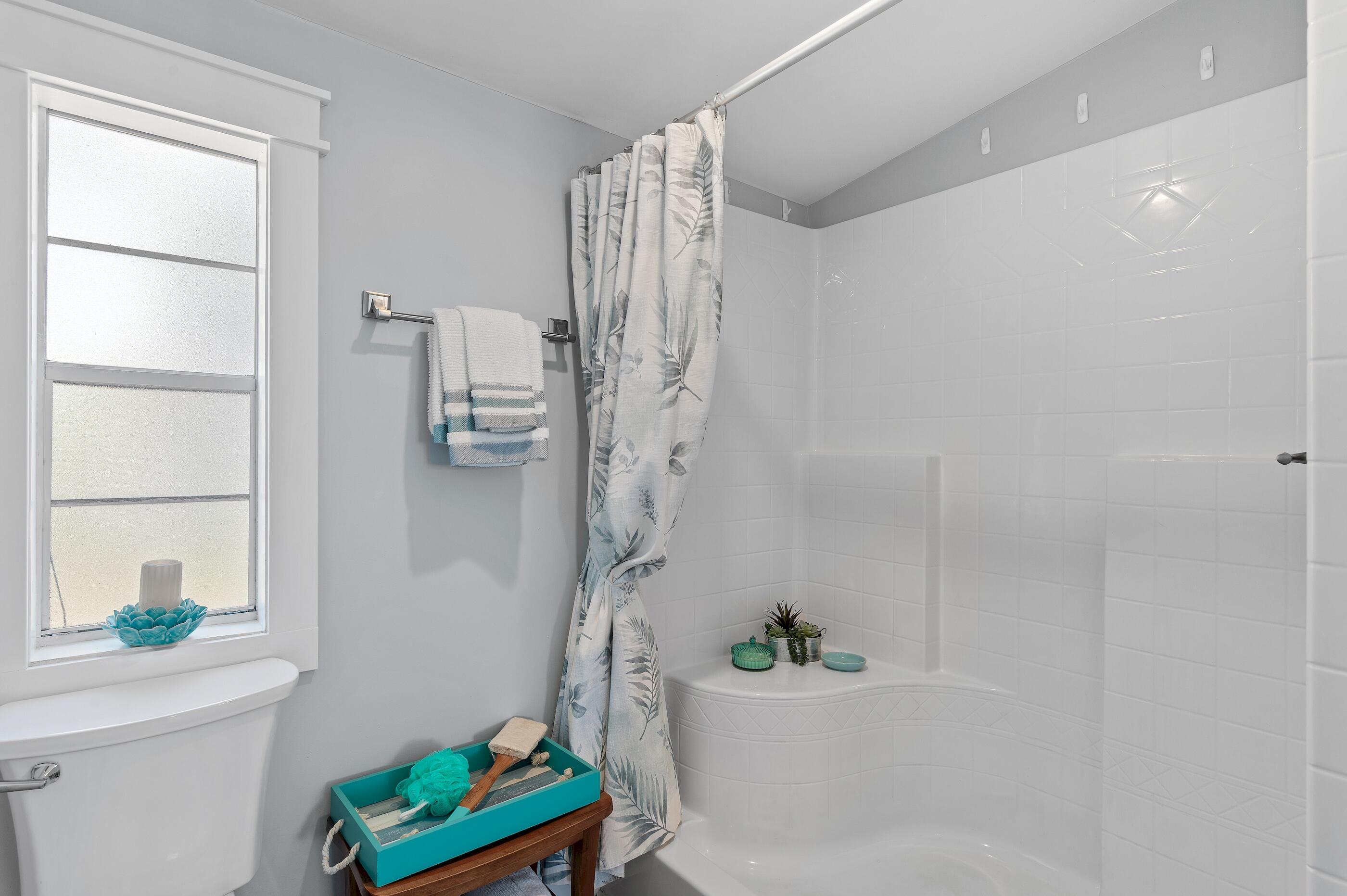 301 Edgewood Terrace Santa Rosa Beach, FL 32459 - Photo 20 of 34 a bathroom with a bathtub and a shower