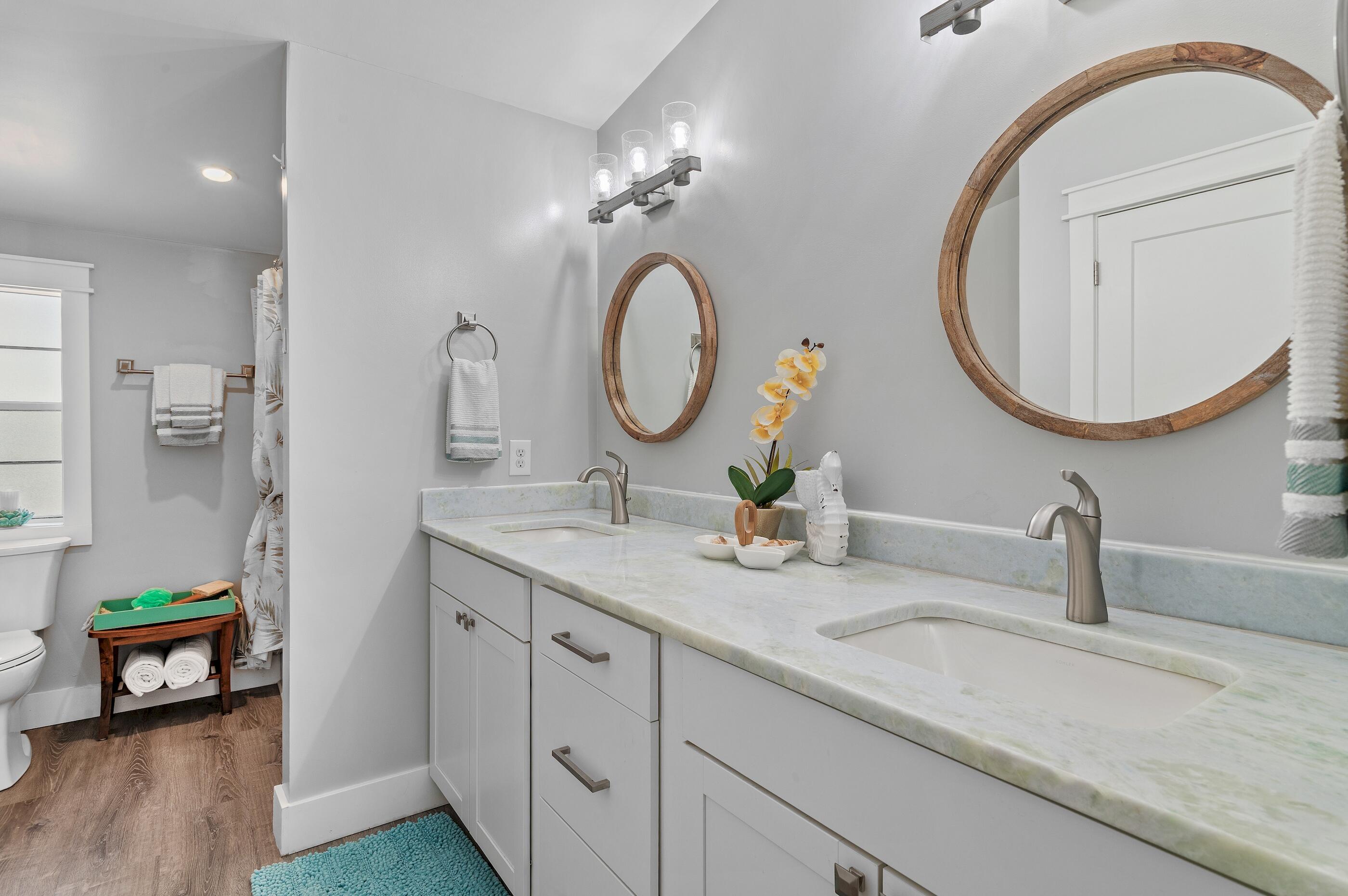 301 Edgewood Terrace Santa Rosa Beach, FL 32459 - Photo 21 of 34 a bathroom with a granite countertop double vanity sink and a mirror