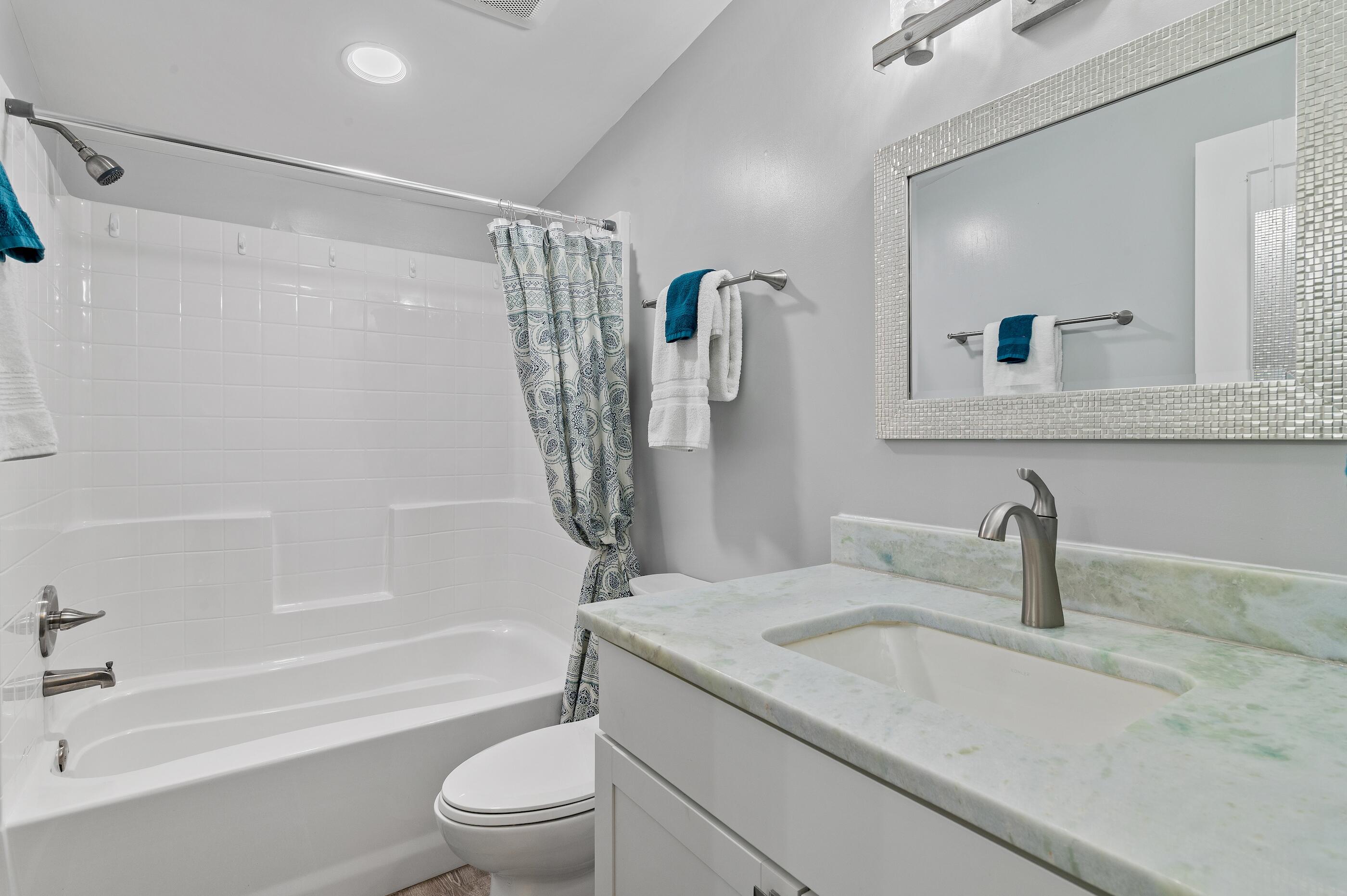 301 Edgewood Terrace Santa Rosa Beach, FL 32459 - Photo 25 of 34 a bathroom with a sink a toilet and a mirror