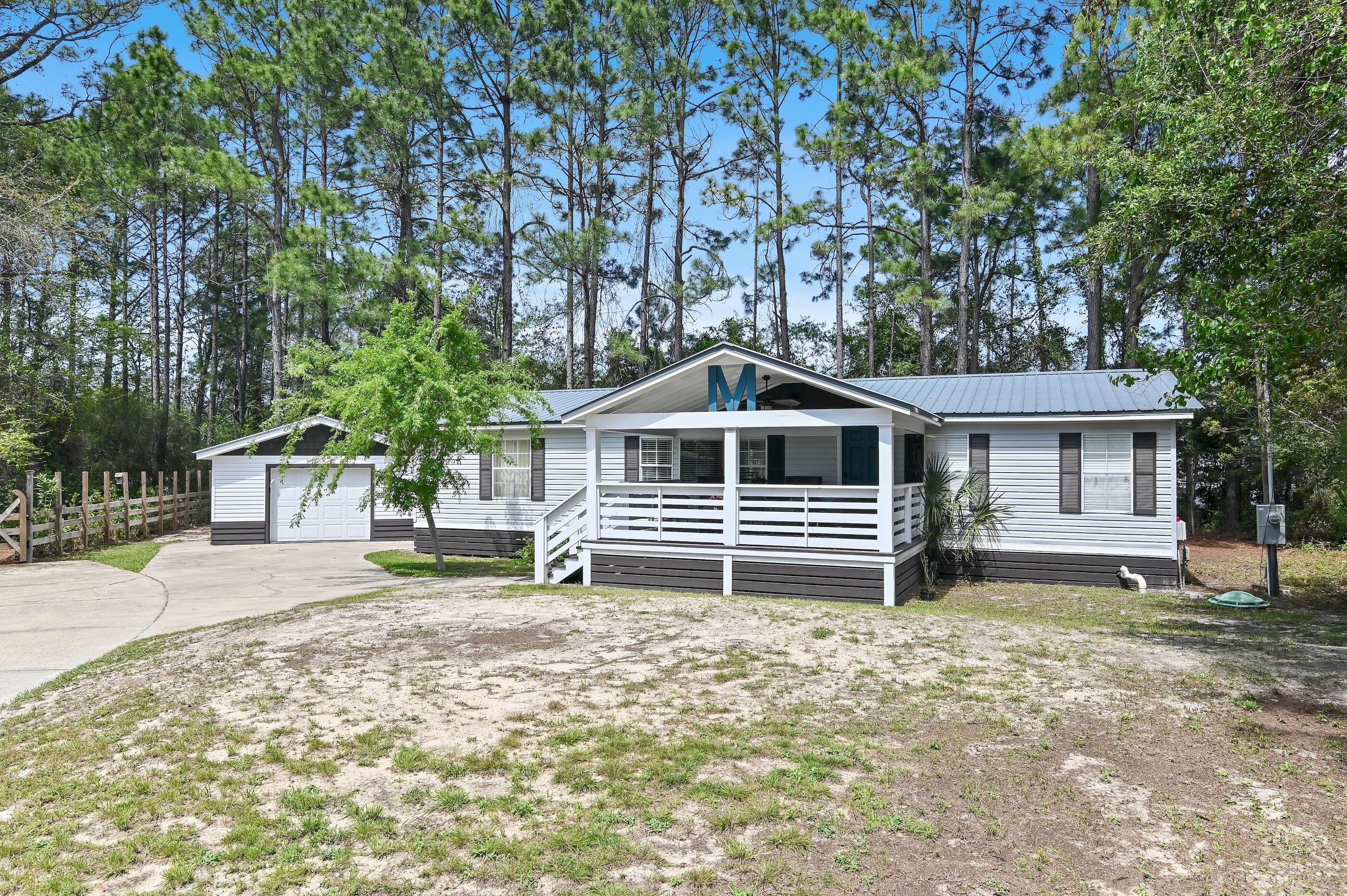 301 Edgewood Terrace Santa Rosa Beach, FL 32459 - Photo 27 of 34 a house with trees in the background