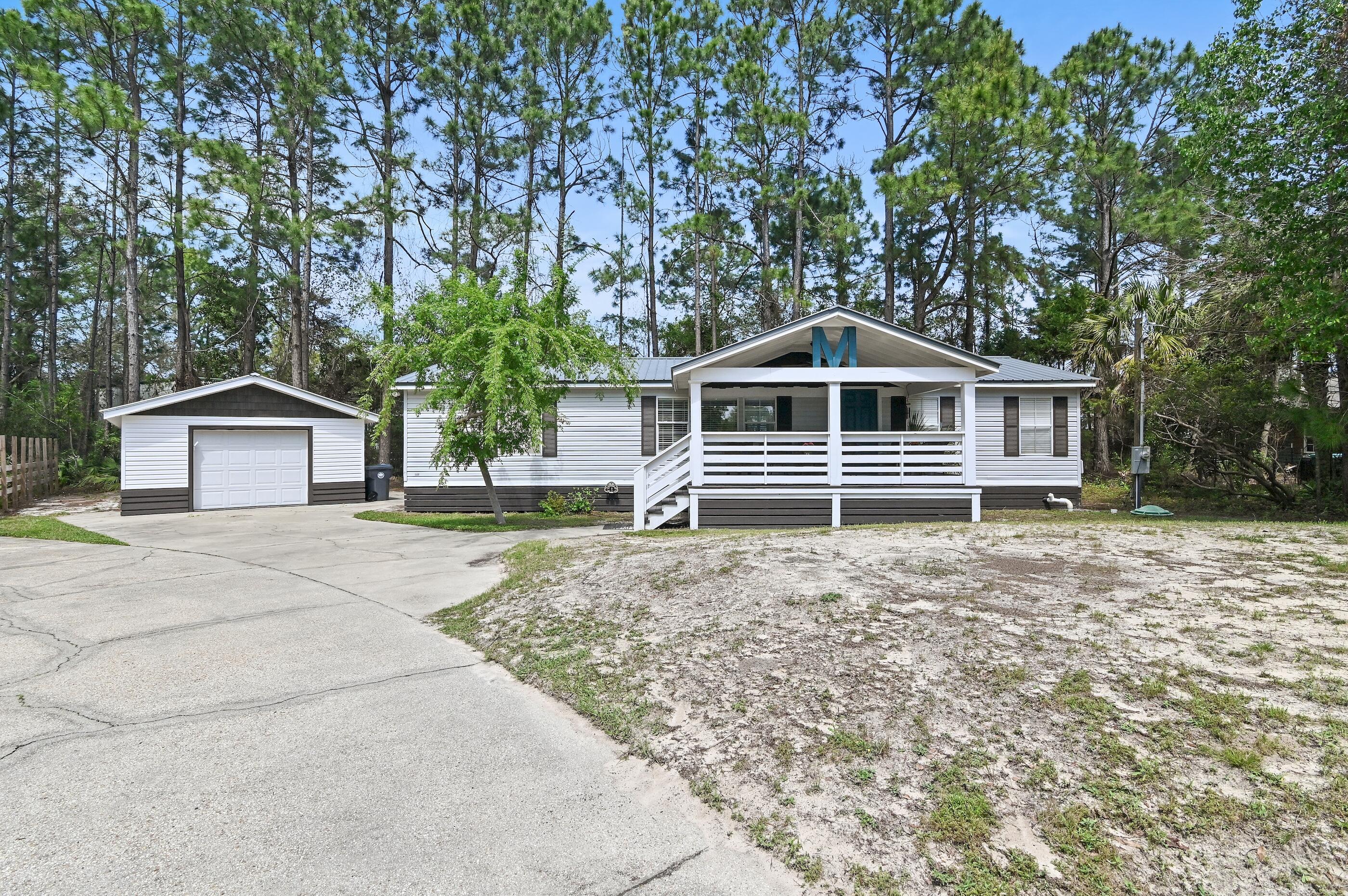 301 Edgewood Terrace Santa Rosa Beach, FL 32459 - Photo 32 of 34 a front view of a house with a yard