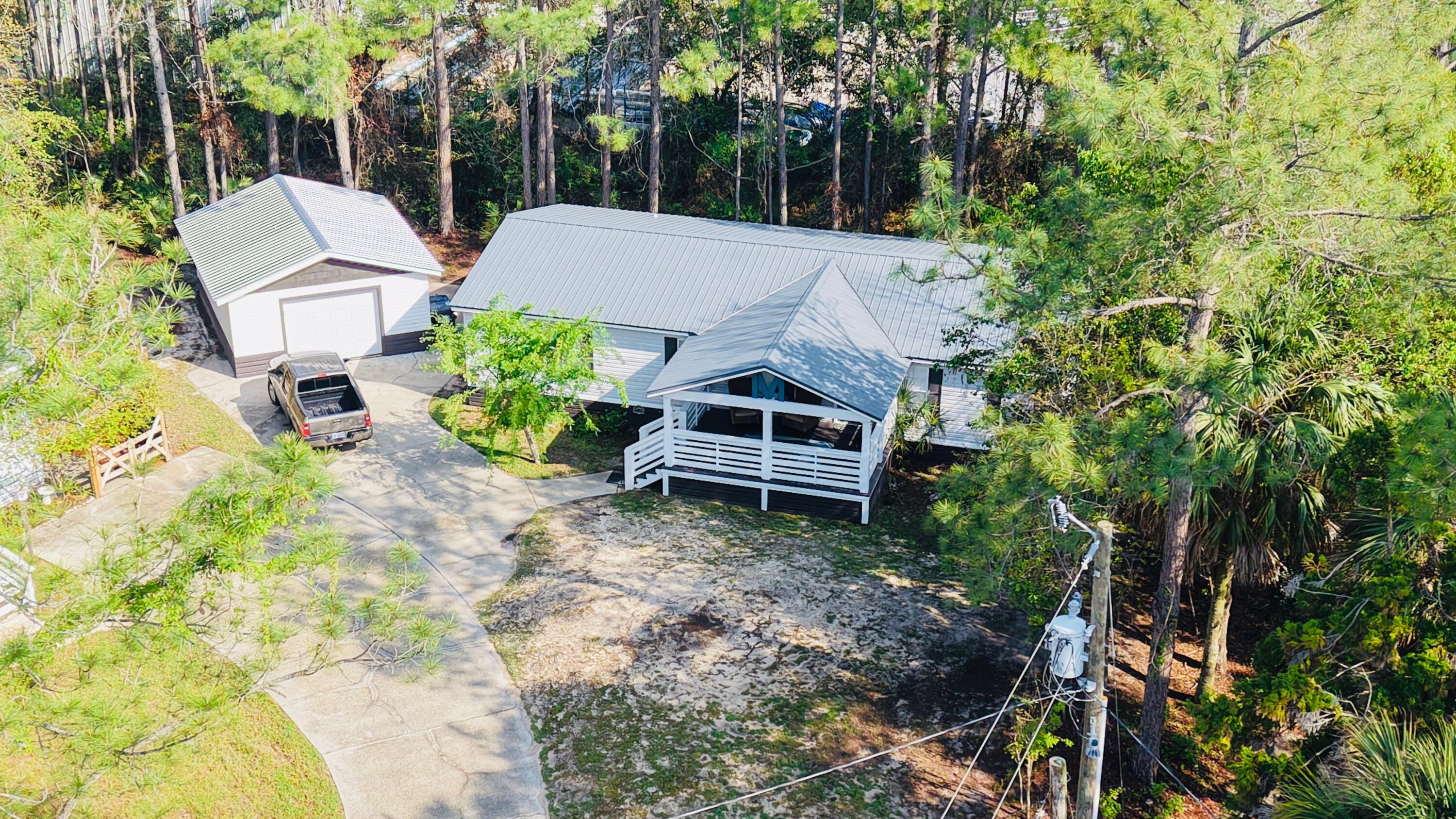 301 Edgewood Terrace Santa Rosa Beach, FL 32459 - Photo 4 of 34 a view of a house with a yard