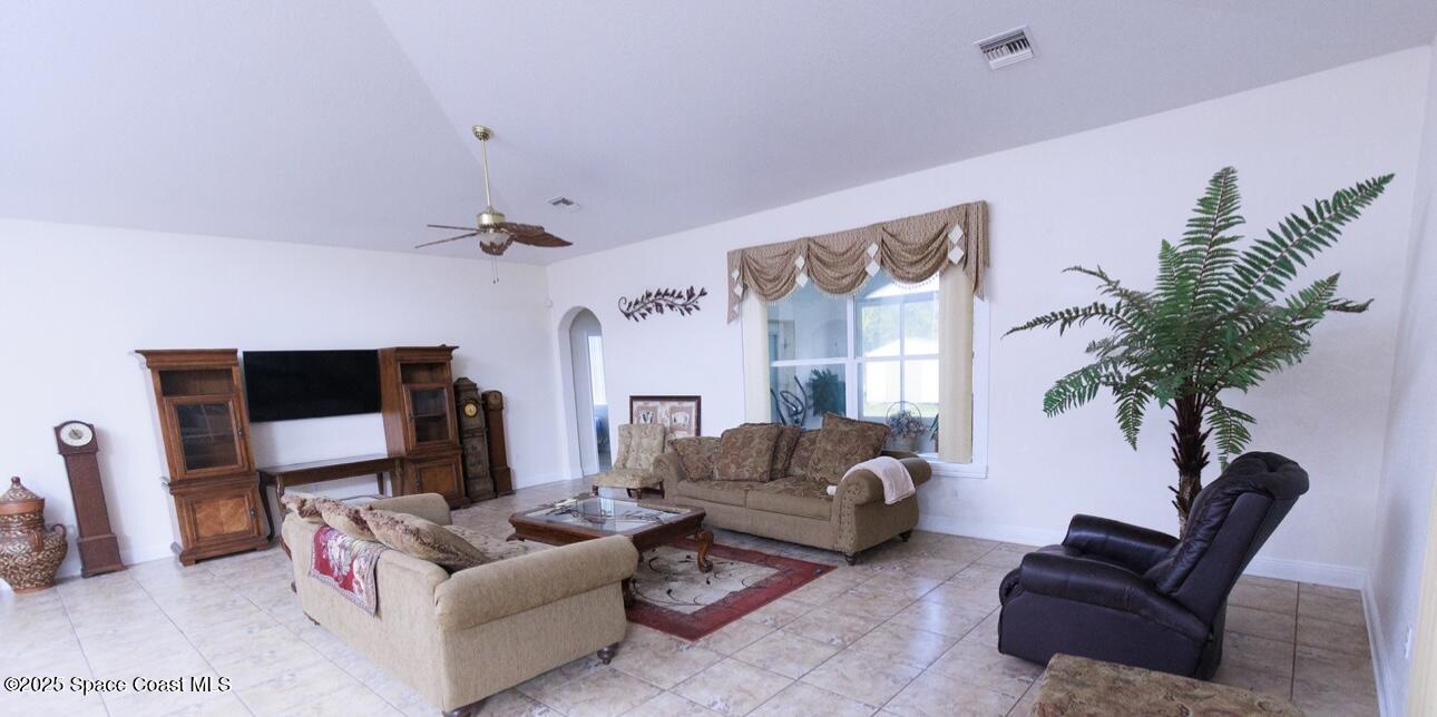 1857 Timbers W Boulevard Rockledge, FL 32955 - Photo 21 of 44 a living room with furniture and a potted plant
