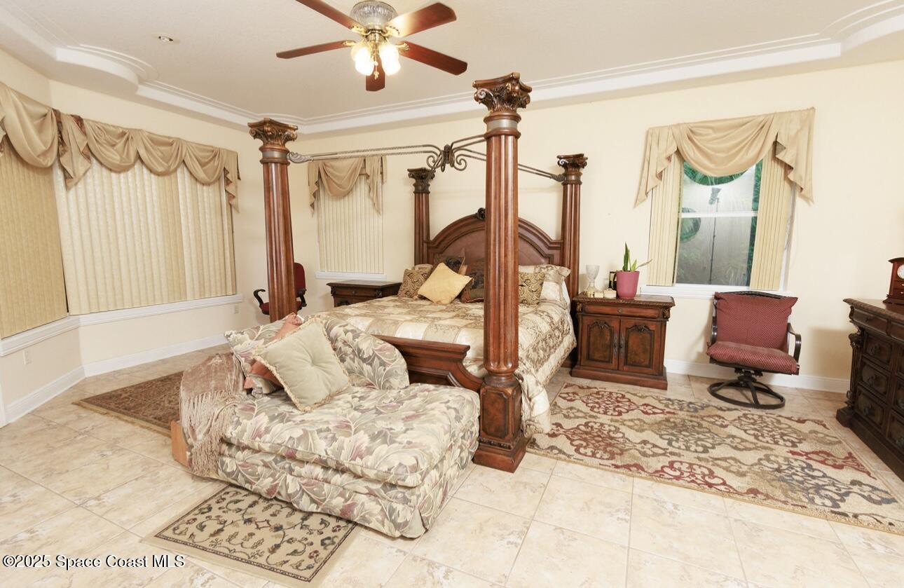 1857 Timbers W Boulevard Rockledge, FL 32955 - Photo 32 of 44 a living room with furniture and a large window