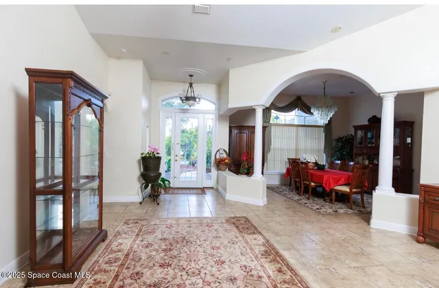 a living room with furniture fireplace and wooden floor
