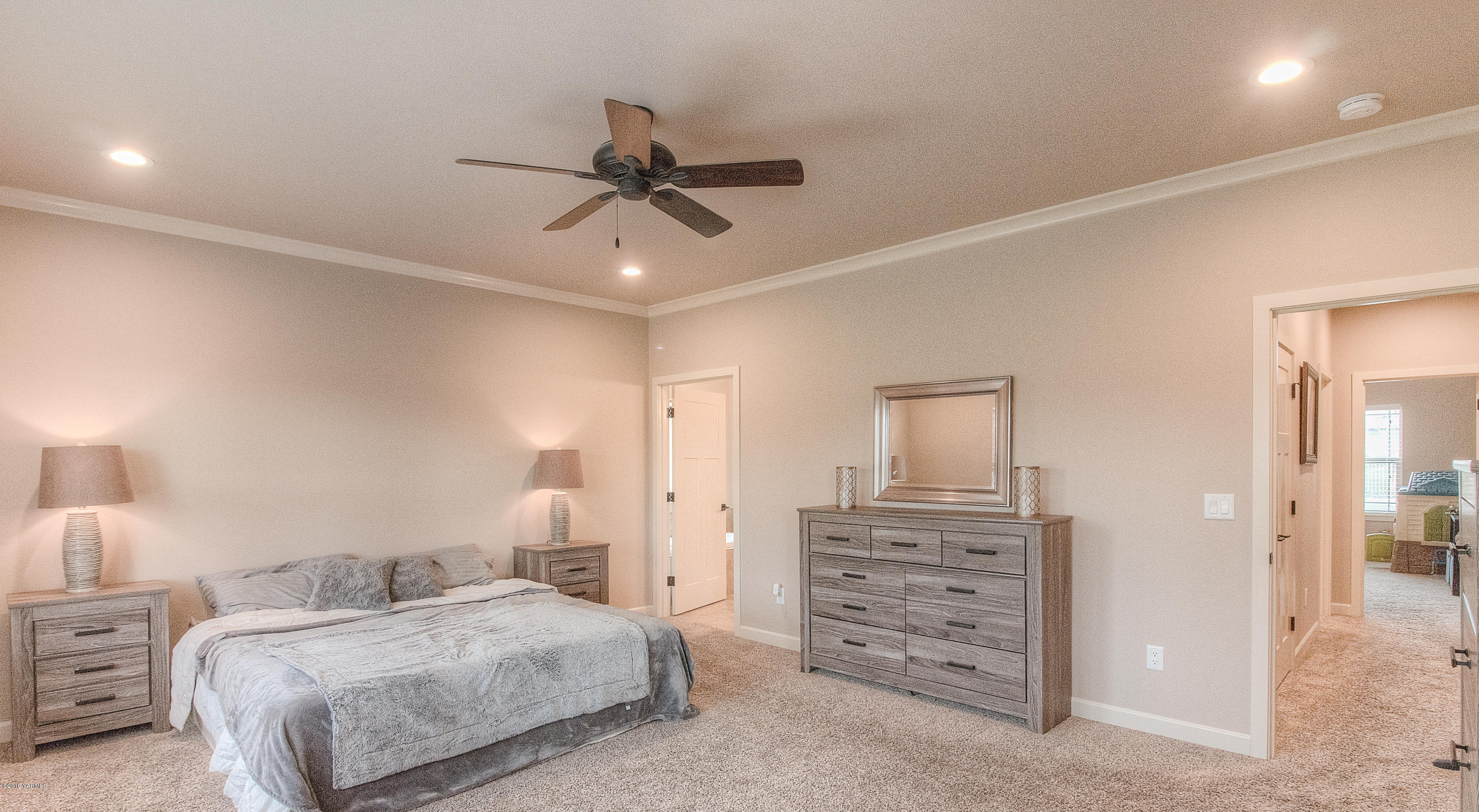 9202 Coolidge Road Yakima, WA 98903 - Photo 17 of 45 a bedroom with a bed and furniture