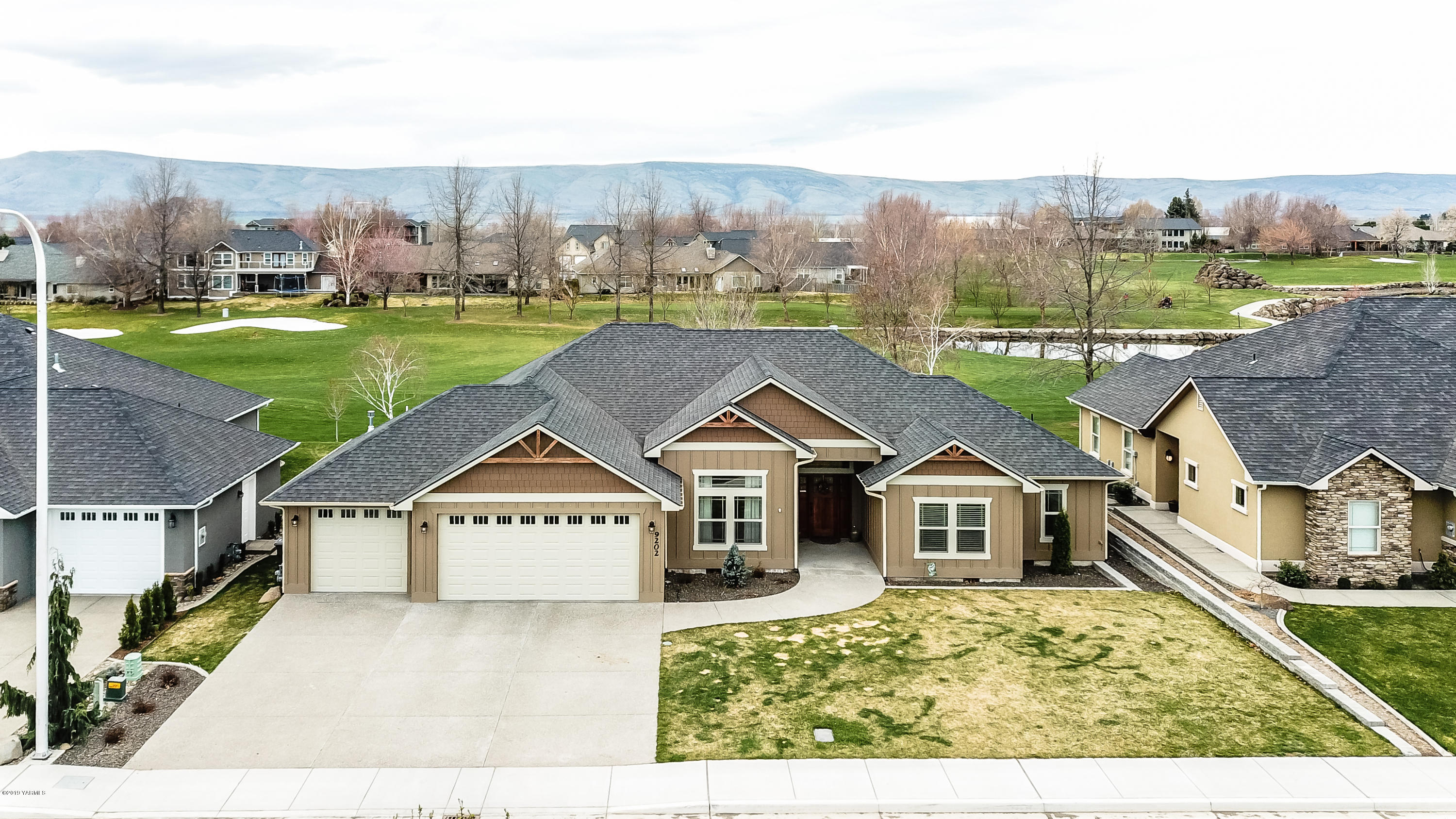 9202 Coolidge Road Yakima, WA 98903 - Photo 38 of 45 a view of a house with a yard