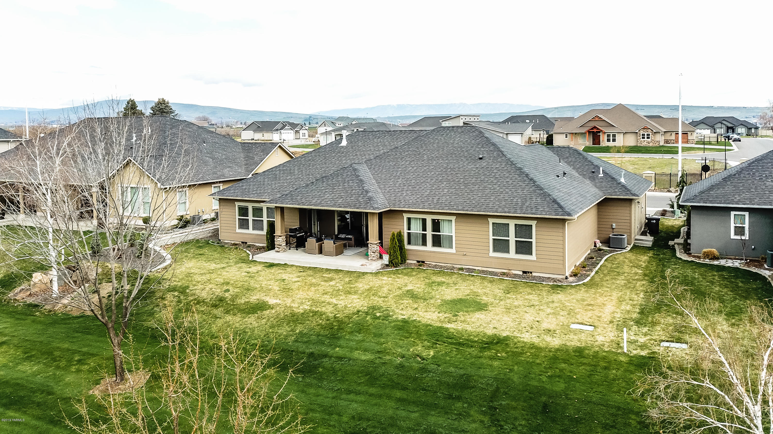 9202 Coolidge Road Yakima, WA 98903 - Photo 39 of 45 a aerial view of a house next to a big yard
