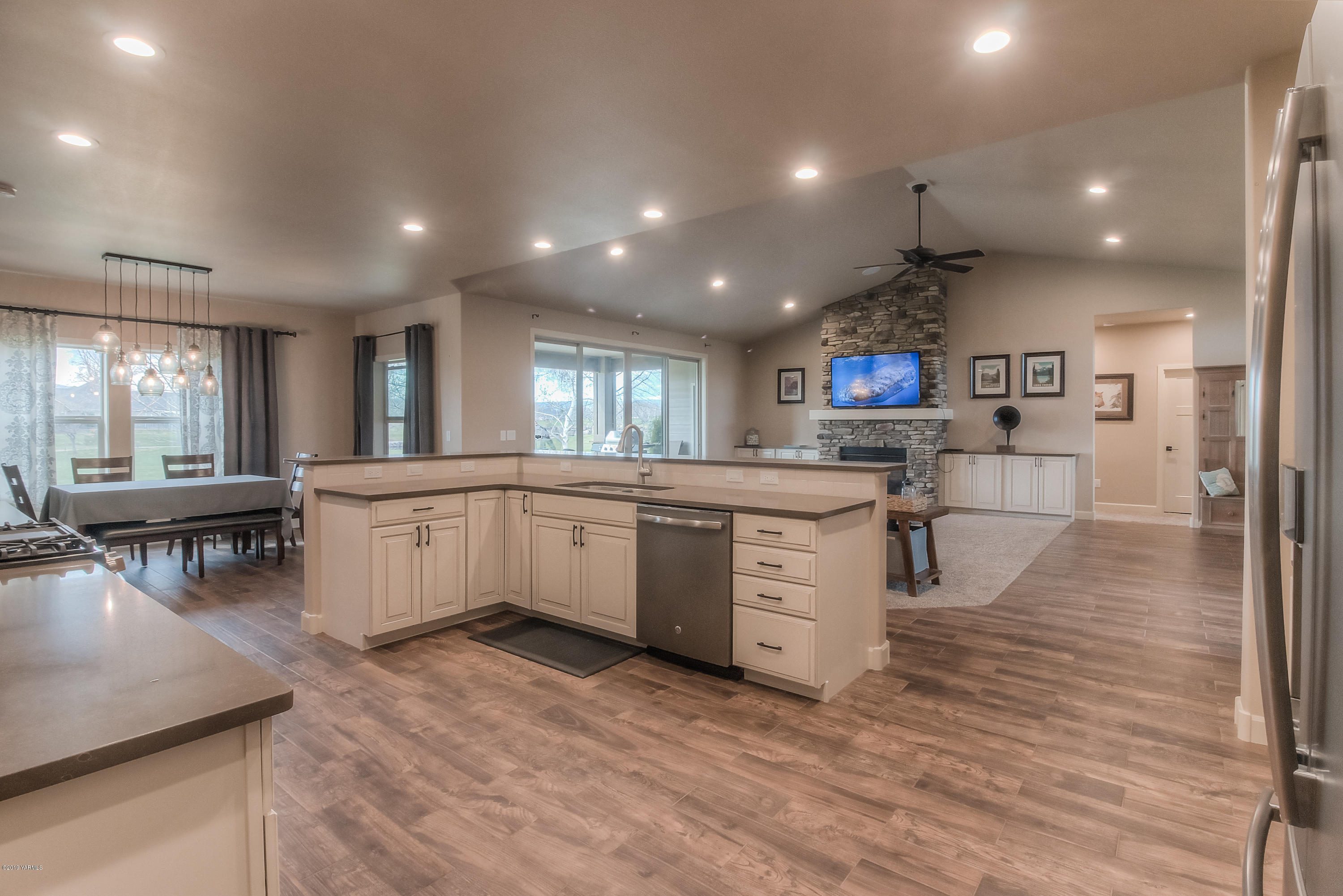 9202 Coolidge Road Yakima, WA 98903 - Photo 7 of 45 a large white kitchen with lots of counter space a sink and appliances