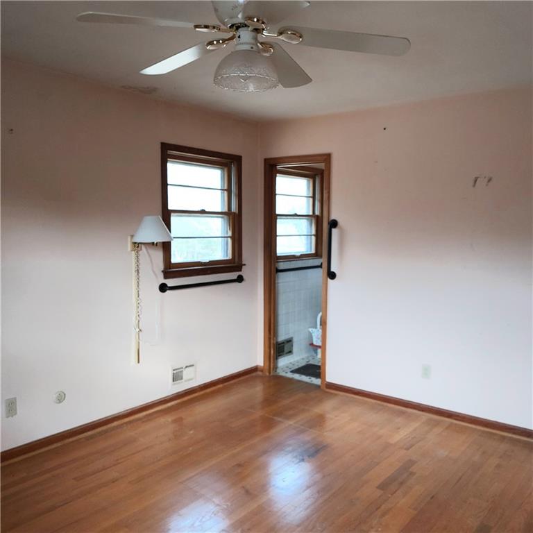 1803 Hasty Road Marietta, GA 30062 - Photo 11 of 23 a view of an empty room with wooden floor and a window