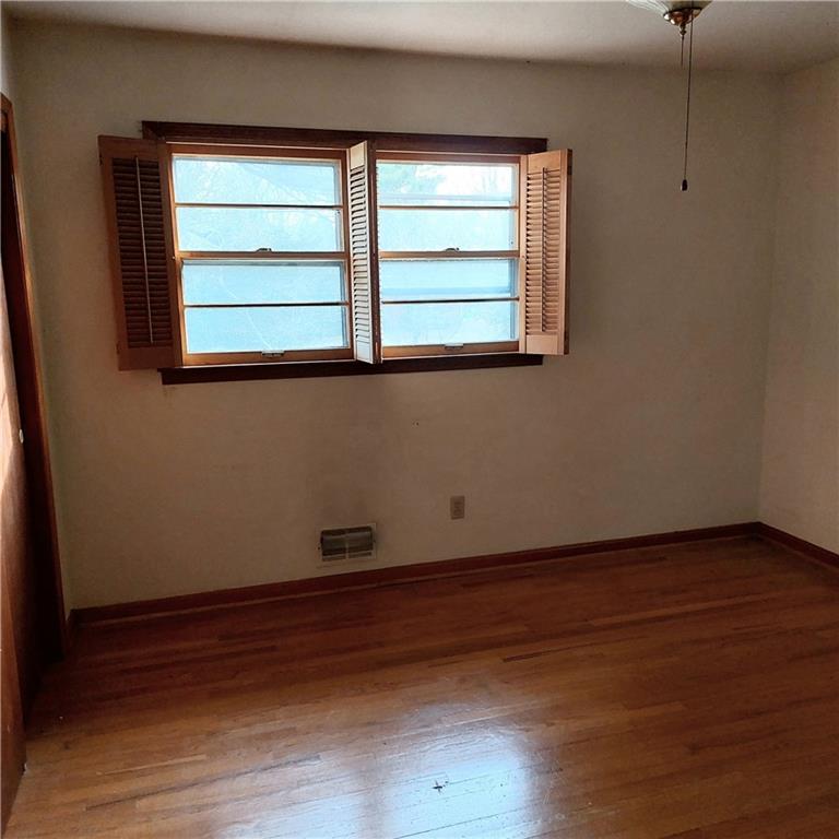1803 Hasty Road Marietta, GA 30062 - Photo 12 of 23 an empty room with wooden floor and windows