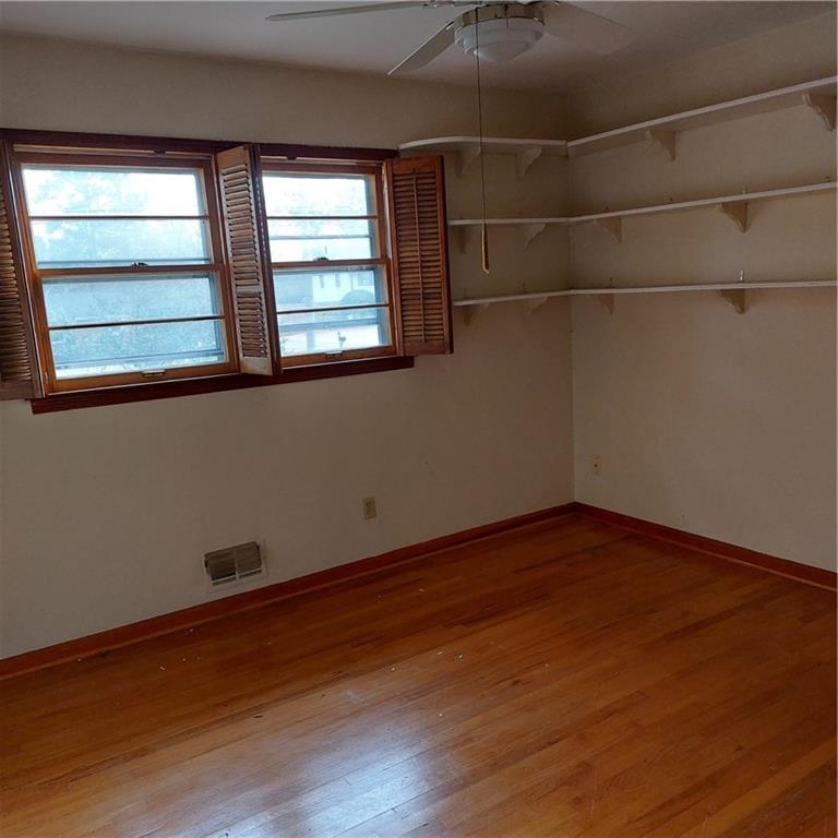 1803 Hasty Road Marietta, GA 30062 - Photo 13 of 23 an empty room with wooden floor and windows