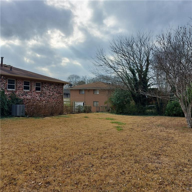 1803 Hasty Road Marietta, GA 30062 - Photo 17 of 23 a front view of a house with a yard and garage
