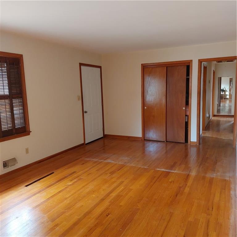 1803 Hasty Road Marietta, GA 30062 - Photo 5 of 23 a view of an empty room with wooden floor and windows