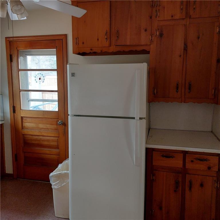1803 Hasty Road Marietta, GA 30062 - Photo 8 of 23 a kitchen with a refrigerator and cabinets