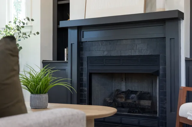 a bathroom with a granite countertop sink a mirror and a shower