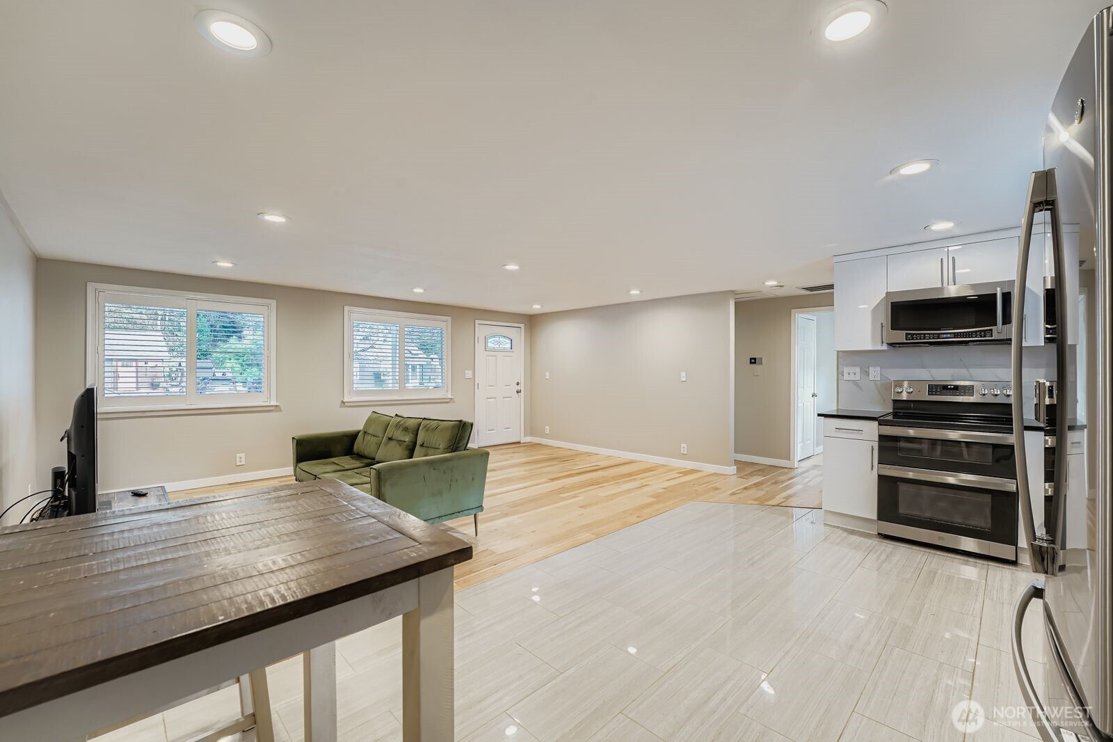 3533 Southeast 5th Street Renton, WA 98058 - Photo 11 of 25 a kitchen with stainless steel appliances granite countertop a sink and cabinets