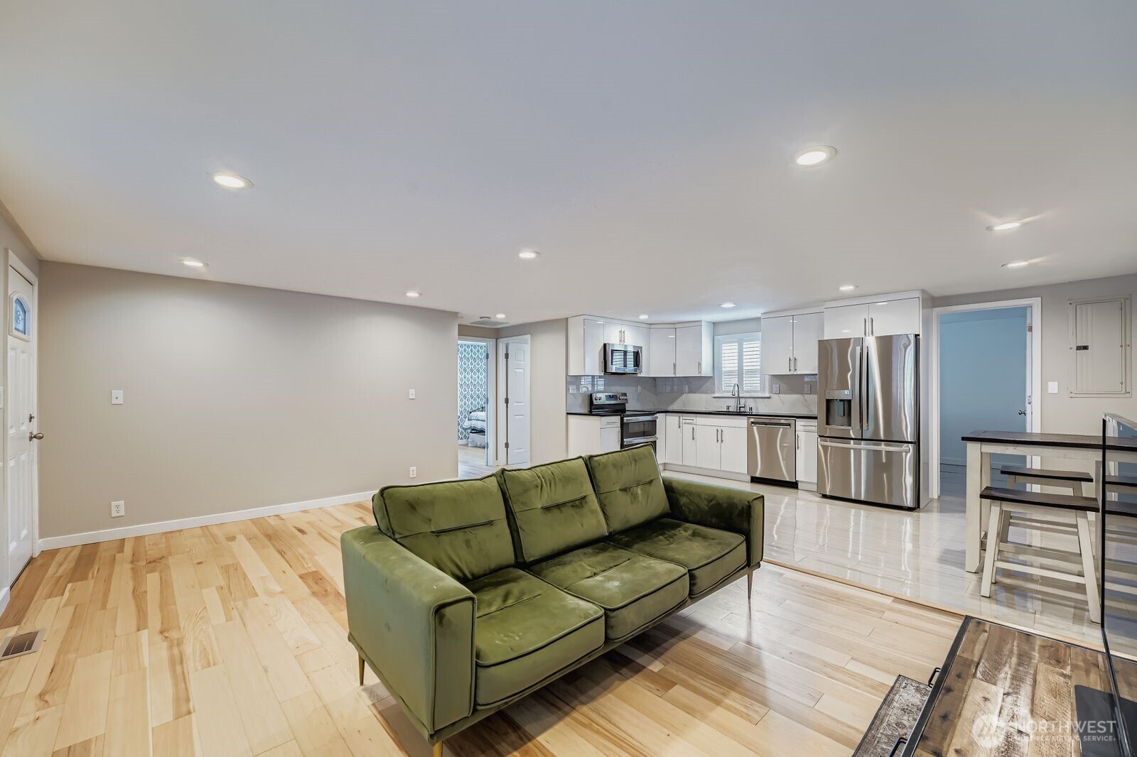 3533 Southeast 5th Street Renton, WA 98058 - Photo 8 of 25 a view of kitchen with kitchen island white cabinets and stainless steel appliances