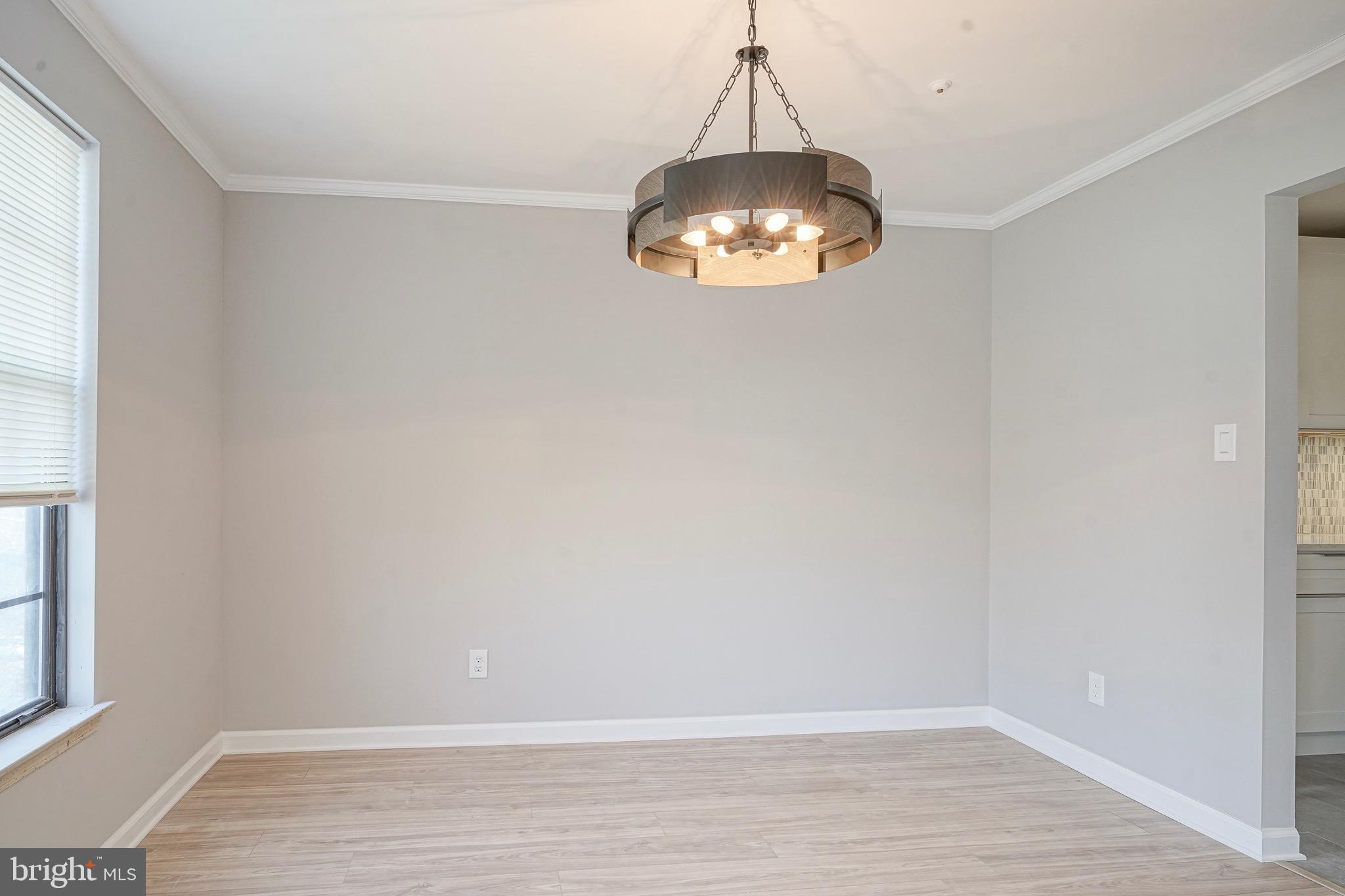 9 Samuel Adams Sewell, NJ 08080 - Photo 4 of 19 a view of an empty room with wooden floor and a window