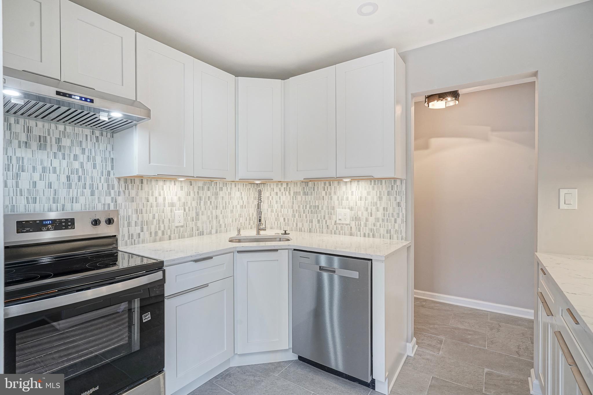 9 Samuel Adams Sewell, NJ 08080 - Photo 6 of 19 a kitchen with a sink stove and cabinets