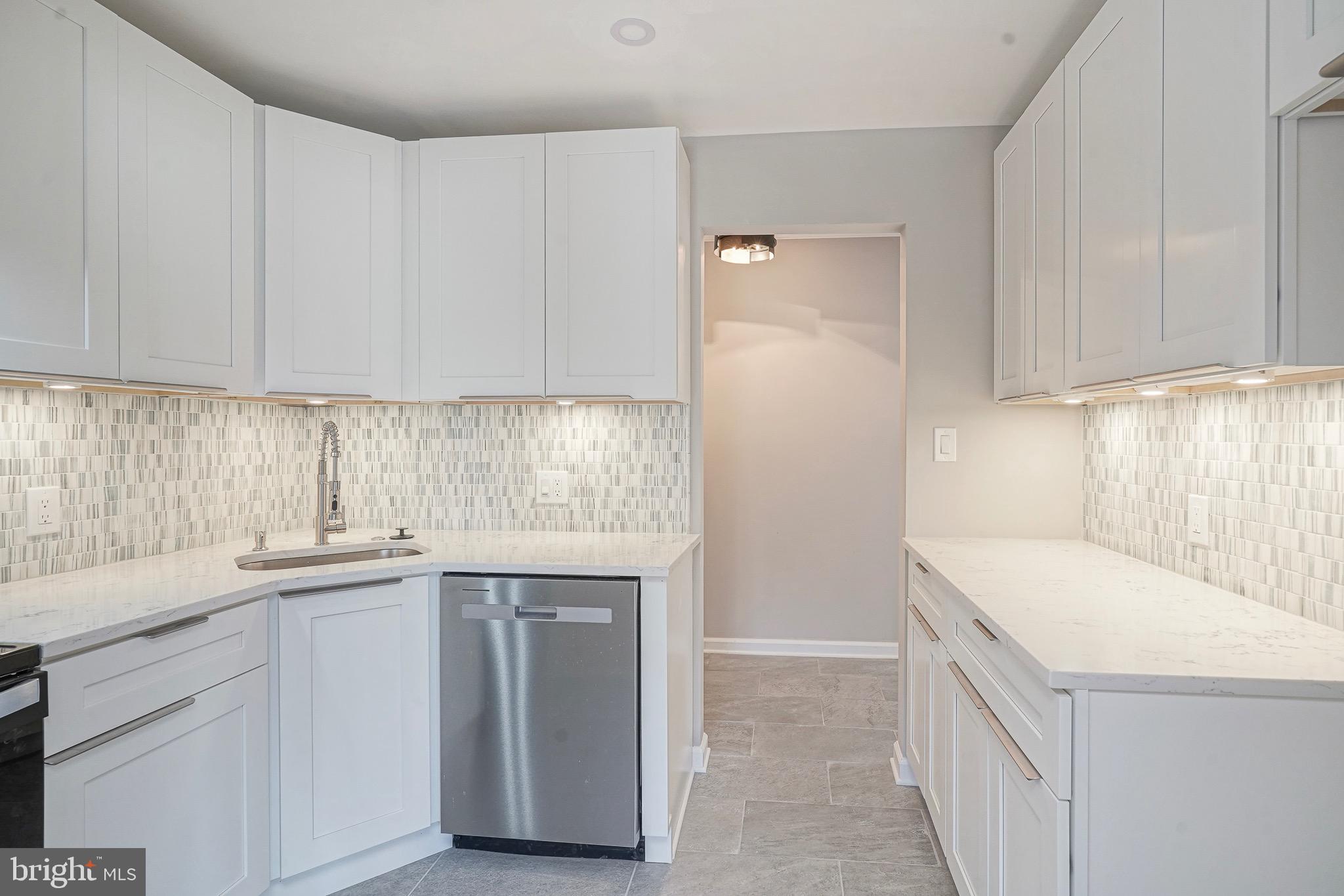 9 Samuel Adams Sewell, NJ 08080 - Photo 7 of 19 a kitchen with a sink a stove and cabinets