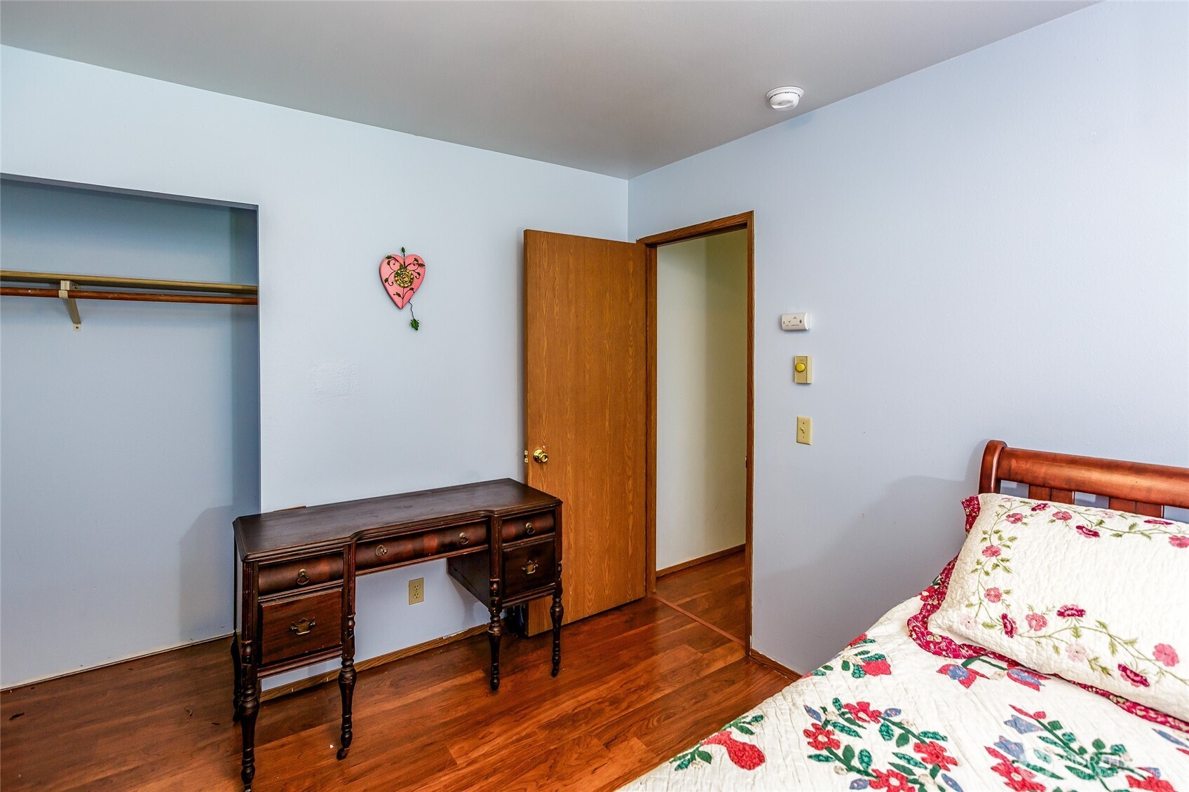 655 Hunt Street Friday Harbor, WA 98250 - Photo 13 of 26 a bedroom with a bed and wooden floor