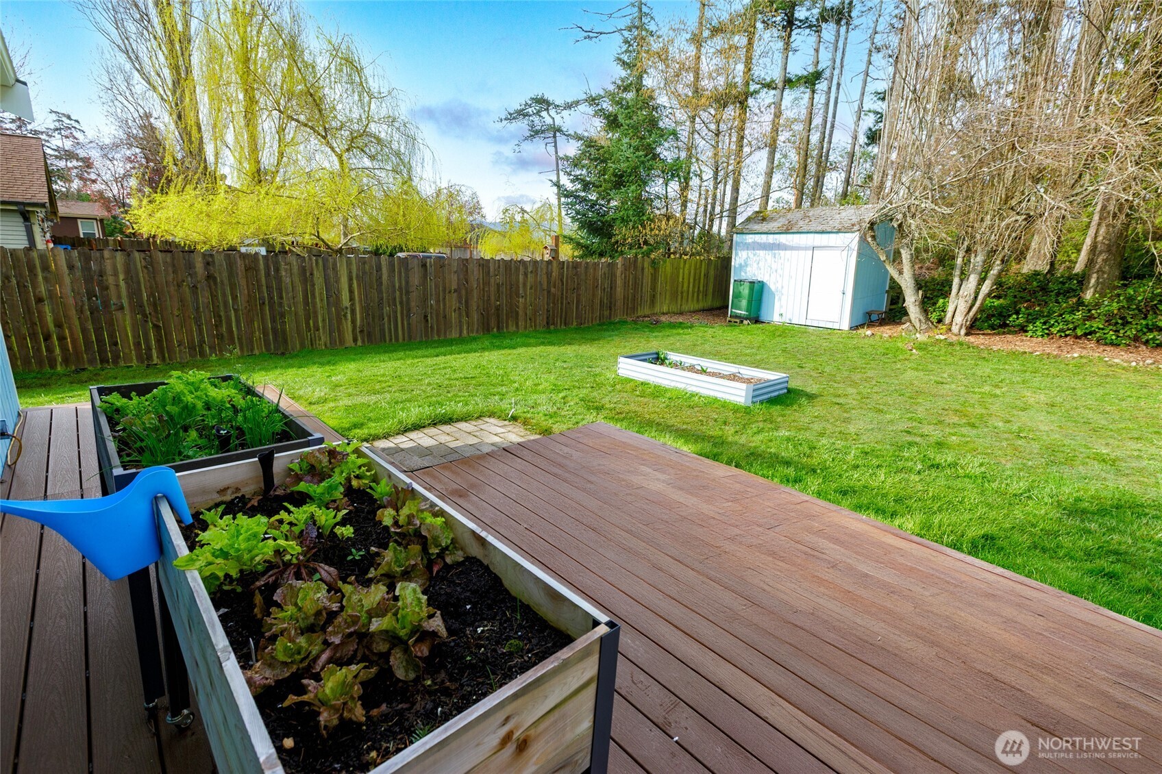 655 Hunt Street Friday Harbor, WA 98250 - Photo 22 of 26 a view of a backyard with wooden fence