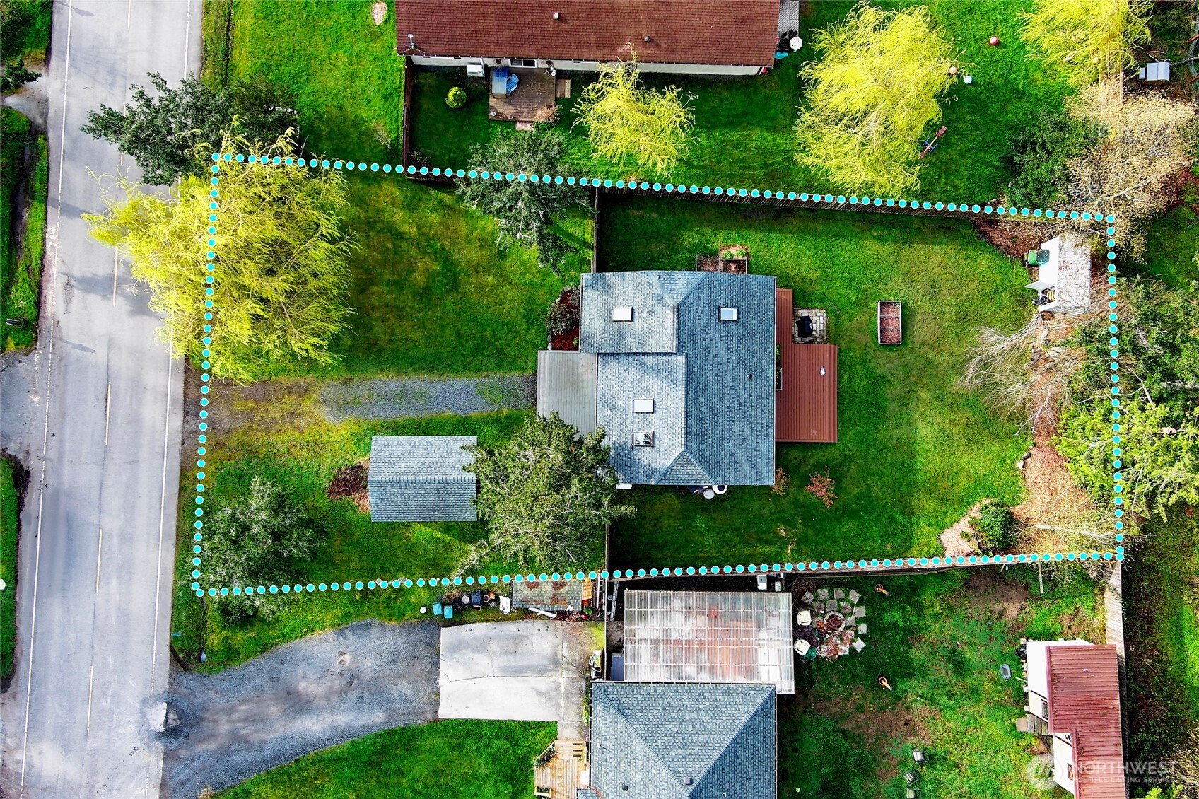 655 Hunt Street Friday Harbor, WA 98250 - Photo 26 of 26 an aerial view of a house with a garden and a yard