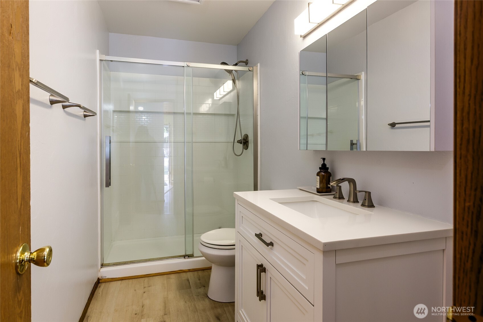 655 Hunt Street Friday Harbor, WA 98250 - Photo 8 of 26 a bathroom with a sink toilet vanity and shower
