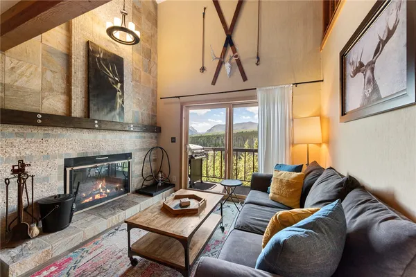 a living room with furniture fireplace and flat screen tv