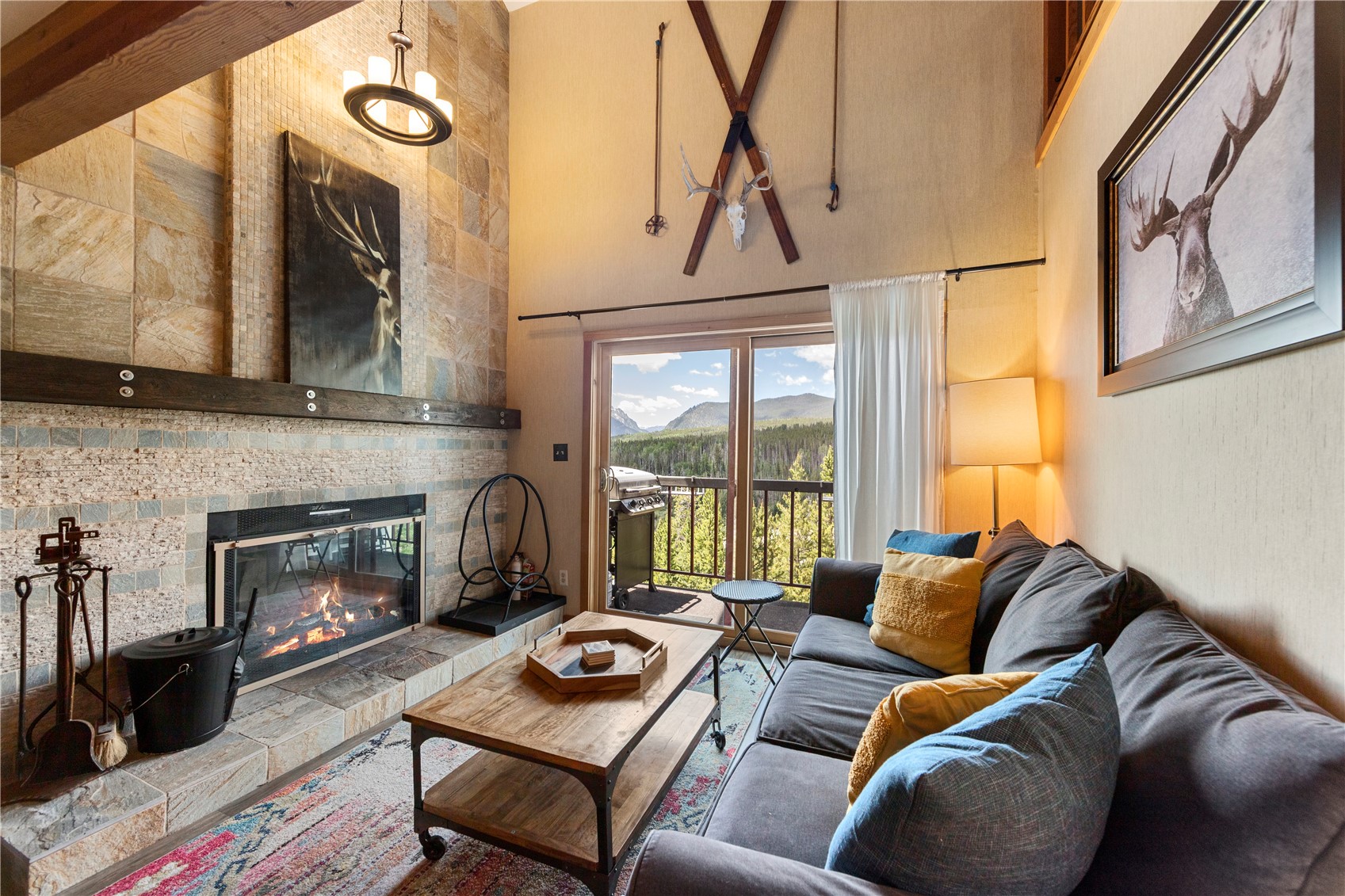 9490 Ryan Gulch Road, Unit 94202 Silverthorne, CO 80498 - Photo 1 of 50 a living room with furniture fireplace and flat screen tv